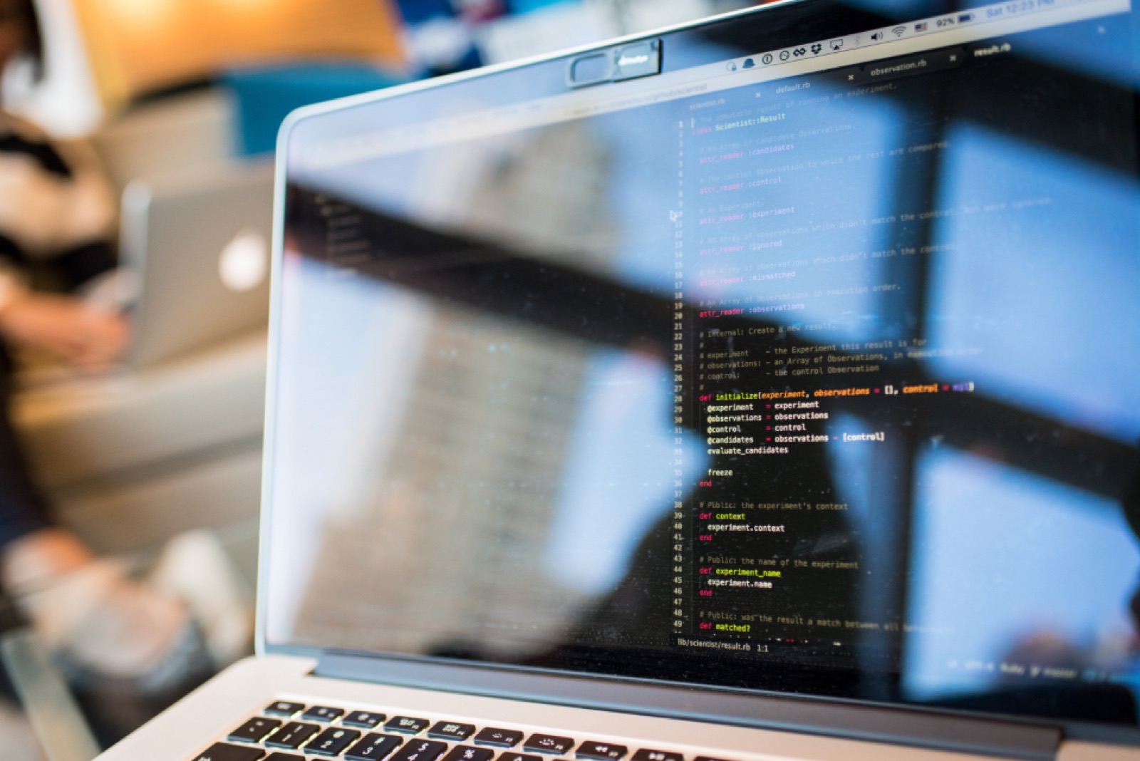 Laptop screen showing source code in a code editor