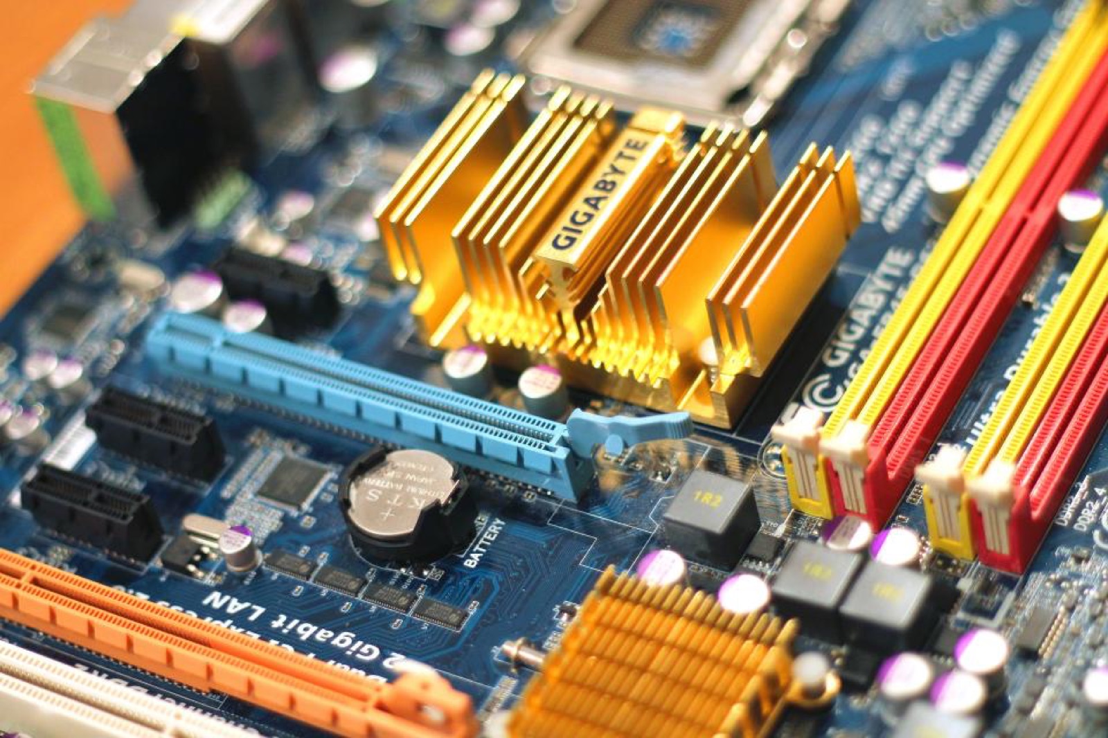 Close-up of a computer motherboard with processors and memory slots