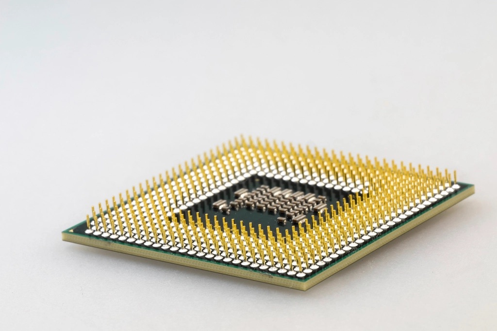 Close-up of a computer processor with rows of gold pins